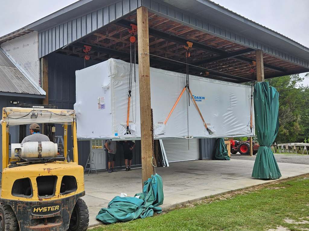 18,000 lbs Chiller floating in air. Our lift system handled it with no problem